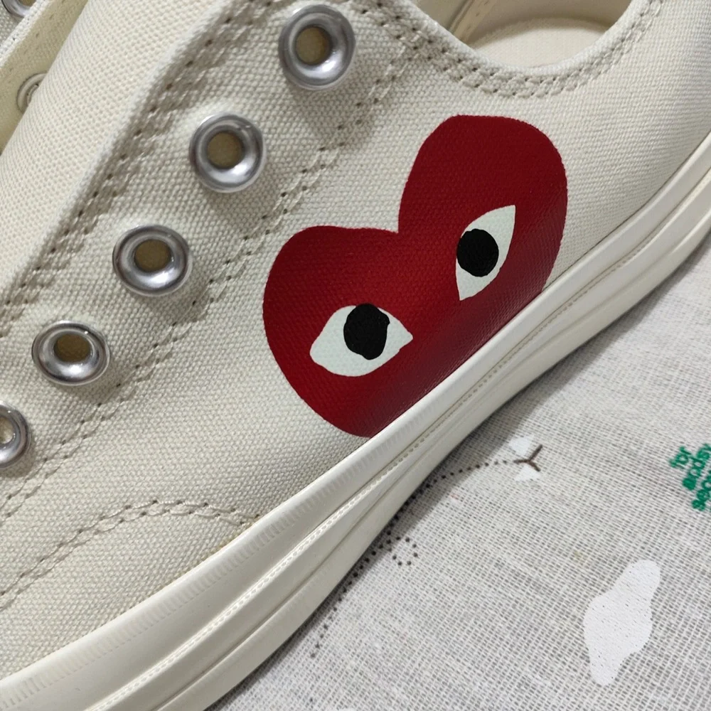 Comme des Garçons PLAY Cream Slip-On Sneakers with Red Heart Logo